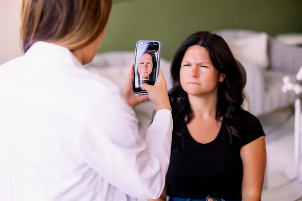 Lyndsay capturing a baseline photo of the patient before treatment